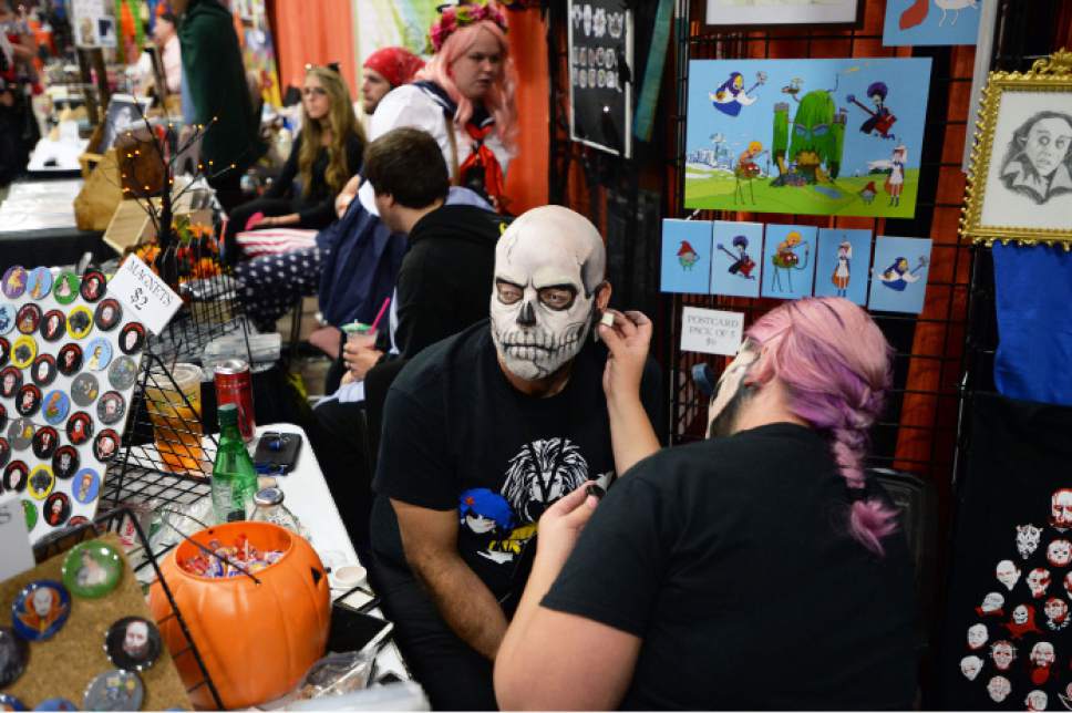 Steve Griffin  |  The Salt Lake Tribune
Amy Bennion, of Bumble-Puppy, puts the finishing touches on Chris Holmes' makeup as Halloween starts early as FearCon, a two-day fan convention for horror fantasy and Halloween-related stuff opens at the Salt Palace Convention Center on Friday in Salt Lake City.