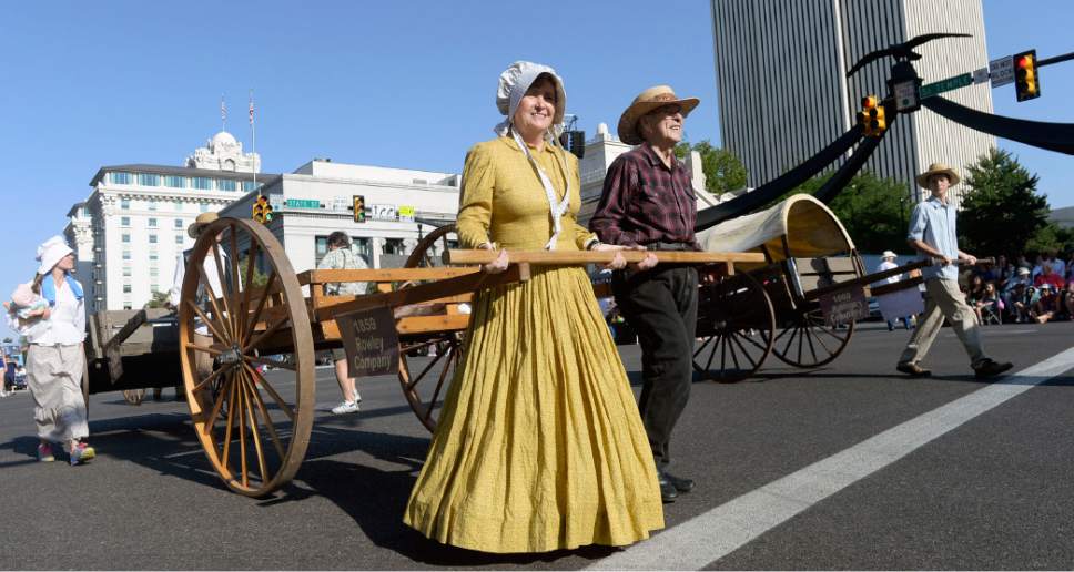 Al Hartmann  |  The Salt Lake Tribune 
Mormon handcart reenactors march in the Day's of 47 parade in downtown Salt Lake City Monday July 25 celebrating Utah's heritage and spirit.