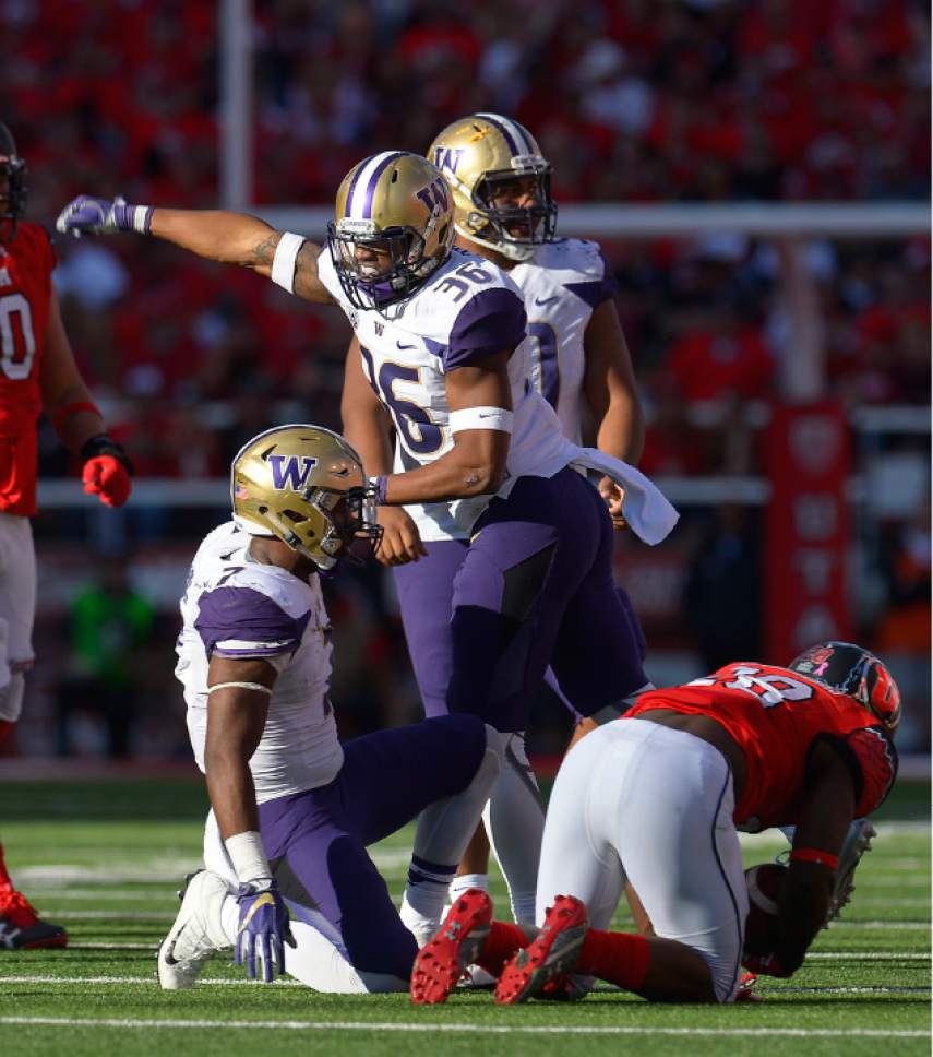 Leah Hogsten  |  The Salt Lake Tribune
Washington Huskies linebacker Azeem Victor (36) celebrates stopping Utah Utes running back Joe Williams (28). University of Washington Huskies defeated University of Utah Utes 31-24 at Rice-Eccles Stadium, Saturday, October 29, 2016.