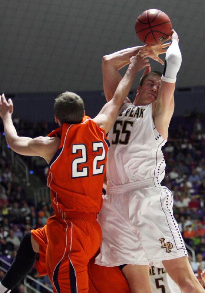 Kim Raff  |  The Salt Lake Tribune
(right) Lone Peak's Eric Mika competes with (left) Brighton's Brandon Miller for a rebound during the 5A state semifinal game at the Dee Event Center in Ogden on March 1, 2013. Lone Peak went on to win the game 53-27.