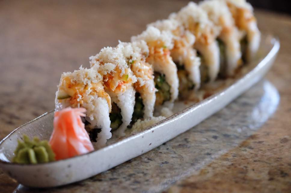 Francisco Kjolseth  |  The Salt Lake Tribune
The Confidential Sushi Roll from Hanabi Sushi in Midvale. Tempura shrimp, spicy tuna, cucumber and cilantro topped with spicy crab, lime, jalapeño, crunches, spicy mayo and sweet sauce.