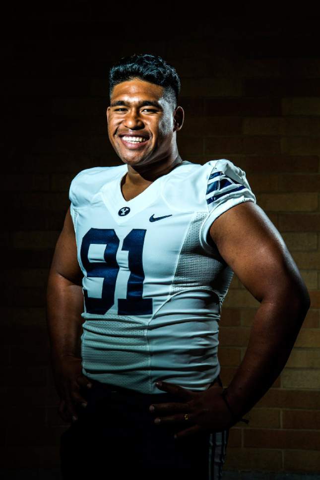 Chris Detrick  |  The Salt Lake Tribune
Brigham Young Cougars defensive lineman Travis Tuiloma (91) poses for a portrait at the indoor practice facility Tuesday August 9, 2016.