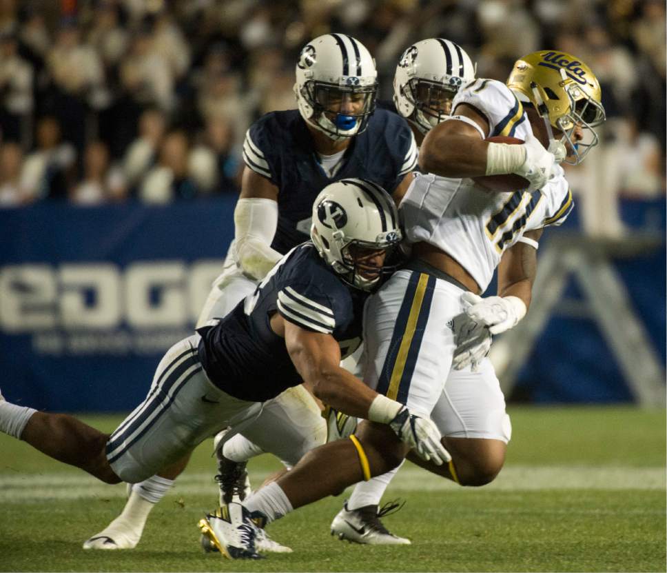 Rick Egan  |  The Salt Lake Tribune

Brigham Young Cougars linebacker Butch Pau'u (38) brings down UCLA Bruins tight end Nate Iese (11), in football action, BYU vs, UCLA, at Lavell Edwards Stadium, Saturday, September 17, 2016.
