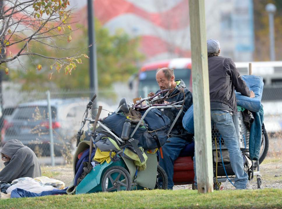 Al Hartmann  |  The Salt Lake Tribune
Homeless gather for the day with their belongings in one of many small camps in the Rio Grande neighborhood Friday morning October 28.  There are many camps along 500 West betwen 200 South and 400 South. Salt Lake City officials and providers are planning for additional emergency shelter space for homeless people when temperatures begin to drop for the winter.