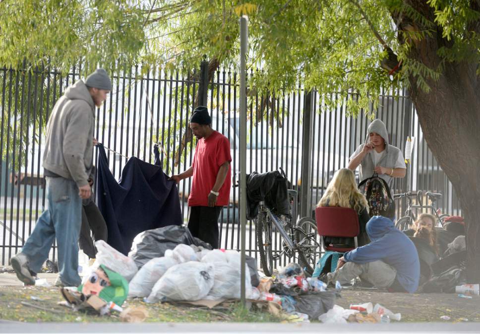 Al Hartmann  |  The Salt Lake Tribune
Homeless gather for the day with their belongings in one of many small camps in the Rio Grande neighborhood Friday morning October 28.  There are a number of camps along 500 West betwen 200 South and 400 South. Salt Lake City officials are planning for additional emergency shelter space for homeless people when temperatures begin to drop for the winter.