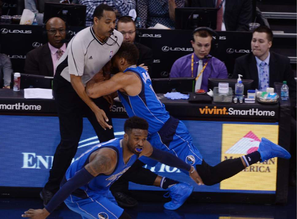 Steve Griffin / The Salt Lake Tribune


Dallas Mavericks guard Justin Anderson (1) crashes into referee Bennie Adams (47) as he tries to grab a loose ball during game against the Utah Jazz at Vivint Smarthome Arena in Salt Lake 
ef47City Wednesday November 2, 2016.