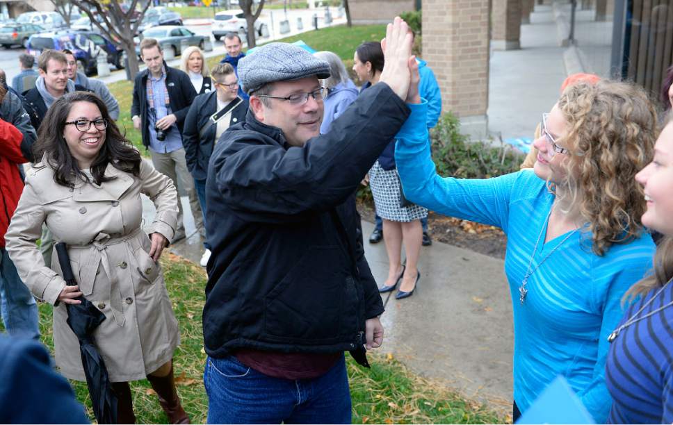 Al Hartmann  |  The Salt Lake Tribune
Actor Sean Astin high fives Democrat fans outside the Salt Lake County building Monday November 1.  He joined  State Democratic chairman Peter Corroon to encourage people to vote early and consistently for every election.