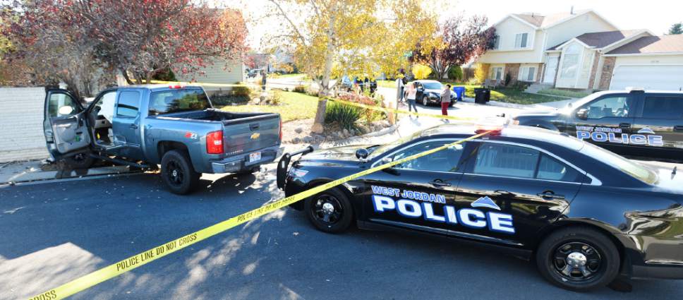 Steve Griffin  |  The Salt Lake Tribune
A bank robbery suspect was critically injured in a shoot-out with police in West Jordan on Wednesday after crashing this truck into a cinderblock wall.