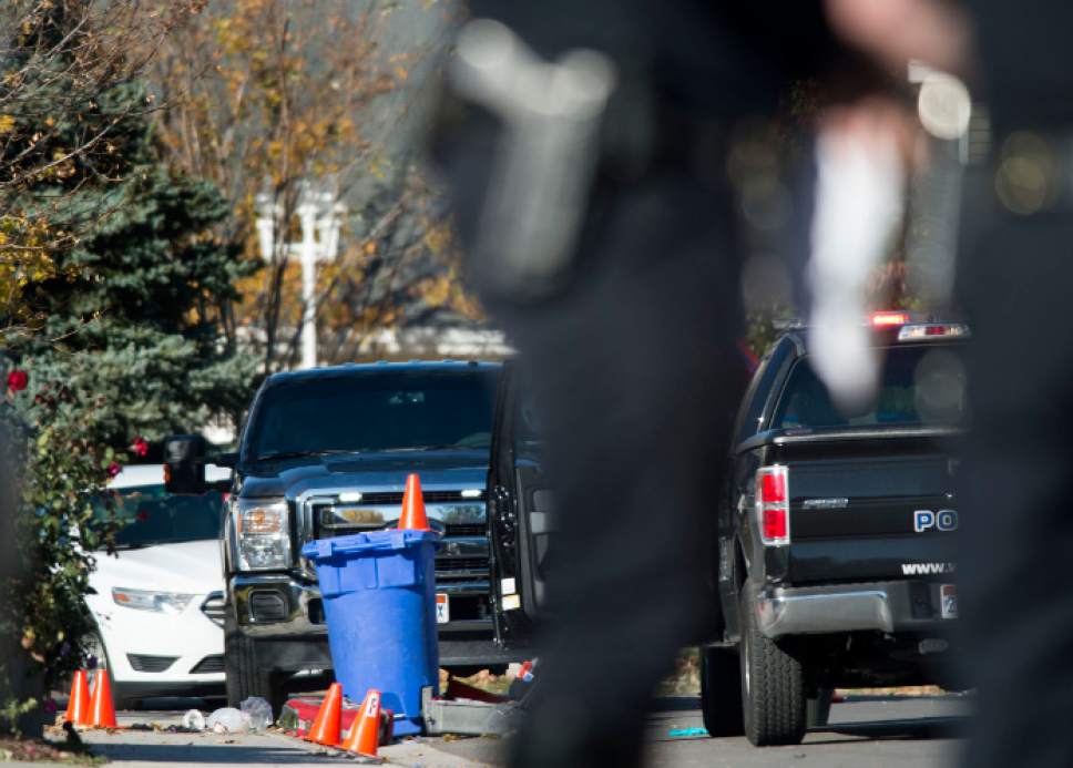 Steve Griffin / The Salt Lake Tribune


Police investigate a crime scene after a bank robbery suspect was critically injured in a shoot-out with police in West Jordan, after crashing his truck into a cinderblock wall, following a robbery and high speed chase at a local credit police reported in West Jordan, Utah Wednesday November, 02, 2016.