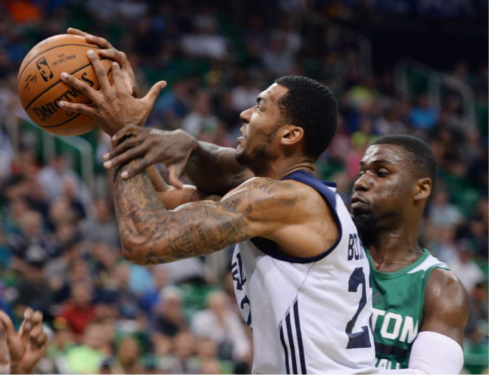 Steve Griffin / The Salt Lake Tribune

Utah Jazz forward Joel Bolomboy gets fouled as he goes to the basket during the Jazz versus Celtics summer league game at the Vivint Smart Home Arena in Salt Lake City Tuesday July 5, 2016.