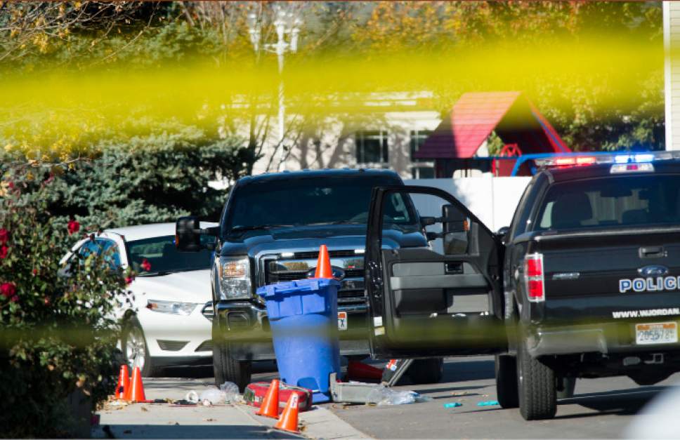 Steve Griffin / The Salt Lake Tribune


Police investigate a crime scene after a bank robbery suspect was critically injured in a shoot-out with police in West Jordan, after crashing his truck into a cinderblock wall, following a robbery and high speed chase at a local credit police reported in West Jordan, Utah Wednesday November, 02, 2016.