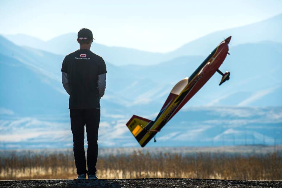 Chris Detrick  |  The Salt Lake Tribune
Brandon Reimschiissel, of Lehi, who has been piloting RC airplanes since he was six years old, flies his Pilot Extra 330 during the grand opening of the Salt Lake City Model Airplane Park,  7595 West California Avenue in Salt Lake City Wednesday November 2, 2016. The new airport includes ample runway space, at 60 feet wide and 550 feet long, and with a 10-foot shoulder on both sides. Amenities for RC hobbyists include a 35-foot concrete helipad and an expansive lay-down and set-up area. The airport space features seven shaded pavilions and a gravel parking area for 92 vehicles.
