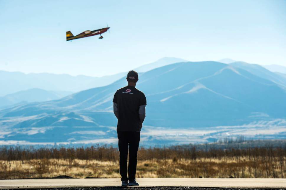 Chris Detrick  |  The Salt Lake Tribune
Brandon Reimschiissel, of Lehi, who has been piloting RC airplanes since he was six years old, flies his Pilot Extra 330 during the grand opening of the Salt Lake City Model Airplane Park,  7595 West California Avenue in Salt Lake City Wednesday November 2, 2016. The new airport includes ample runway space, at 60 feet wide and 550 feet long, and with a 10-foot shoulder on both sides. Amenities for RC hobbyists include a 35-foot concrete helipad and an expansive lay-down and set-up area. The airport space features seven shaded pavilions and a gravel parking area for 92 vehicles.