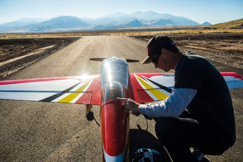 Chris Detrick  |  The Salt Lake Tribune
Brandon Reimschiissel, of Lehi, who has been piloting RC airplanes since he was six years old, works on his Pilot Extra 330 during the grand opening of the Salt Lake City Model Airplane Park,  7595 West California Avenue in Salt Lake City Wednesday November 2, 2016. The new airport includes ample runway space, at 60 feet wide and 550 feet long, and with a 10-foot shoulder on both sides. Amenities for RC hobbyists include a 35-foot concrete helipad and an expansive lay-down and set-up area. The airport space features seven shaded pavilions and a gravel parking area for 92 vehicles.