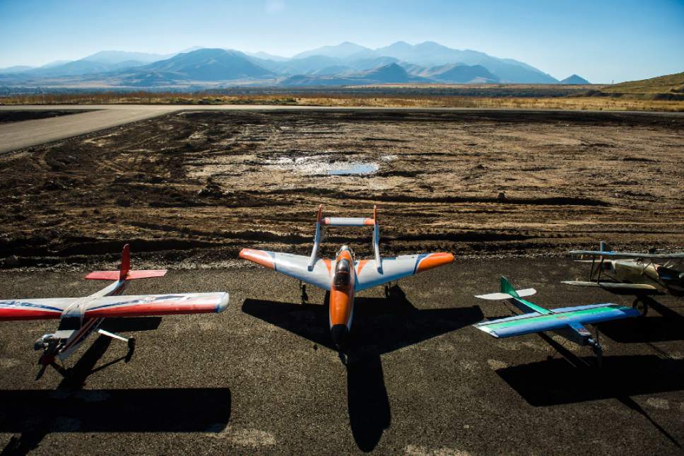 Chris Detrick  |  The Salt Lake Tribune
RC airplanes ready to fly during the grand opening of the Salt Lake City Model Airplane Park,  7595 West California Avenue in Salt Lake City Wednesday November 2, 2016. The new airport includes ample runway space, at 60 feet wide and 550 feet long, and with a 10-foot shoulder on both sides. Amenities for RC hobbyists include a 35-foot concrete helipad and an expansive lay-down and set-up area. The airport space features seven shaded pavilions and a gravel parking area for 92 vehicles.