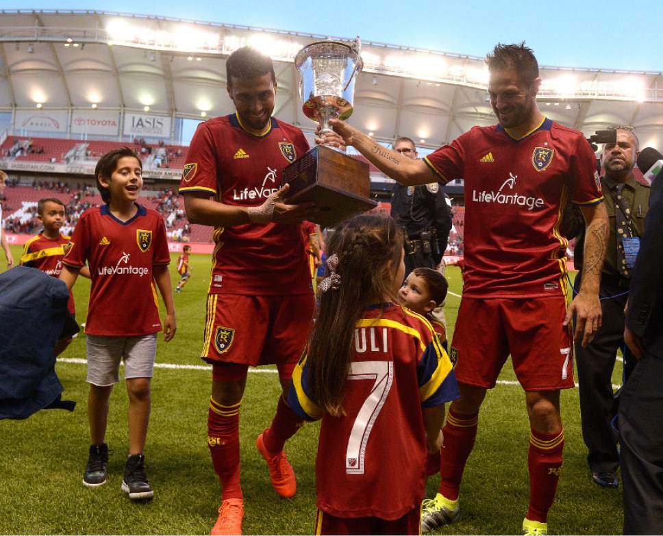 Leah Hogsten  |  The Salt Lake Tribune
Real Salt Lake midfielder Javier Morales (11) and Real Salt Lake forward Juan Martinez (7) and their children celebrate winning the Rocky Mountain Cup. Real Salt Lake defeated the Colorado Rapids 2-1 during their Rocky Mountain Championship Cup game at Rio Tinto Stadium Friday, August 26, 2016.