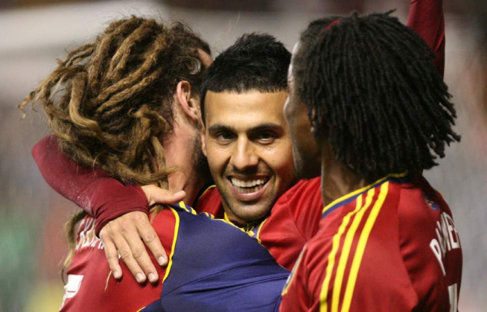Leah Hogsten  |  The Salt Lake Tribune
Real Salt Lake midfielder Javier Morales (11) celebrates his 2nd half goal with teammates Real Salt Lake midfielder Kyle Beckerman (5) andReal Salt Lake midfielder/defender Lovel Palmer (7). Real Salt Lake defeated the Portland Timbers 4-2  during their first leg of the Western Conference final series Sunday, November 10, 2013 at Rio Tinto Stadium.