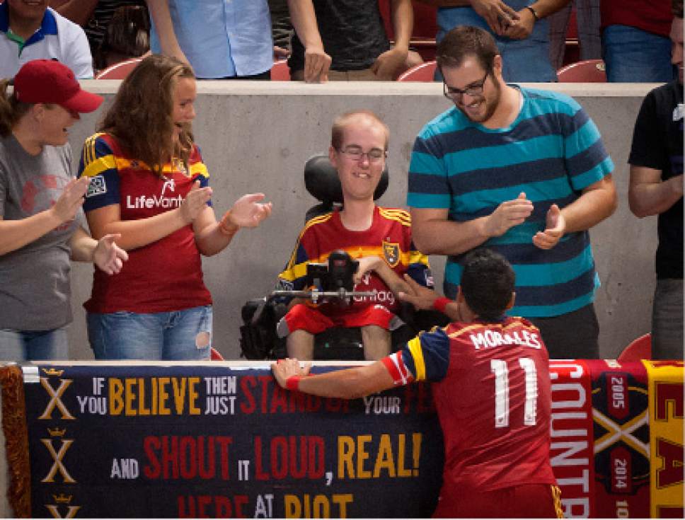 Michael Mangum  |  Special to the Tribune

Real Salt Lake midfielder Javier Morales (11) celebrates his first half goal with Real Salt Lake fan Sean Johnson during their match at Rio Tinto Stadium in Sandy, UT on Friday, July 24, 2015. Real Salt Lake had the lead 1-0 at halftime.
