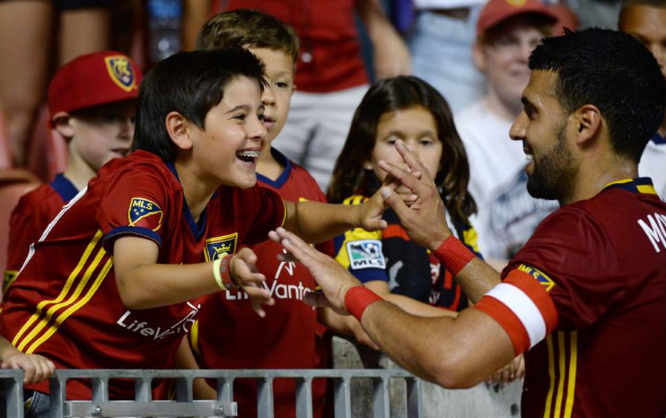 Steve Griffin / The Salt Lake Tribune

Santiago Morales reaches for his father Real Salt Lake midfielder Javier Morales (11) after RSL defeated the New York Red Bulls at Rio Tinto Stadium in Sandy Wednesday June 22, 2016.