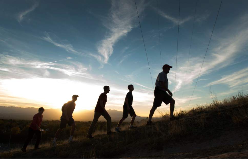 Rick Egan  |  The Salt Lake Tribune

Brian Anderson (right) takes a hike after work in the fading sunlight, with his family along the shoreline trail, Thursday, October 23, 2014. Left to right, Sue, Nick, and Mac, Sam, and Brian Anderson.