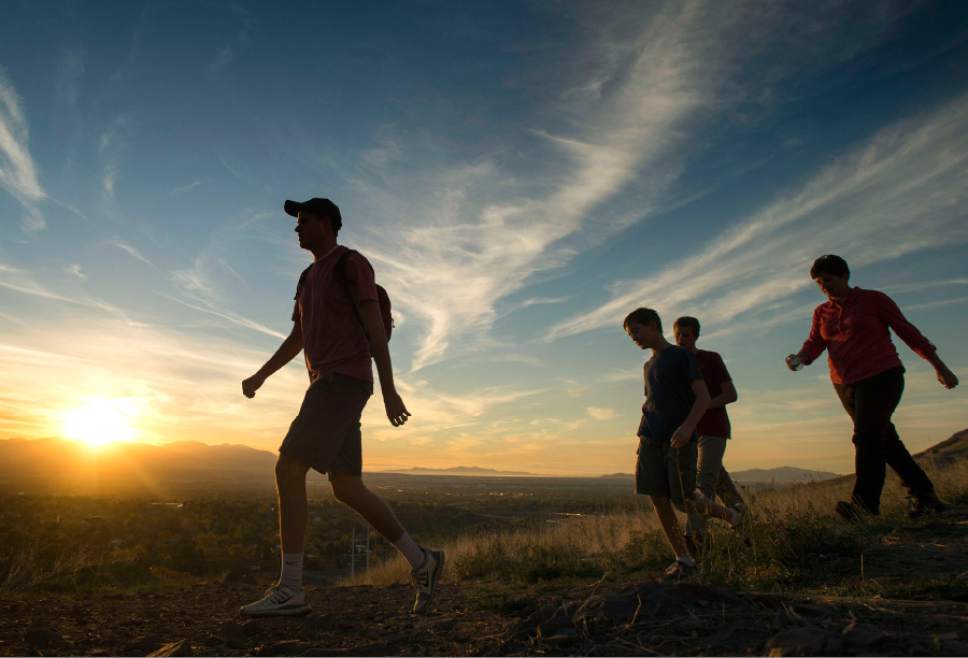 Rick Egan  |  The Salt Lake Tribune

Nick, Sam, Mac, and Sue Anderson take a hike after work in the fading sunlight along the shoreline trail, Thursday, October 23, 2014.