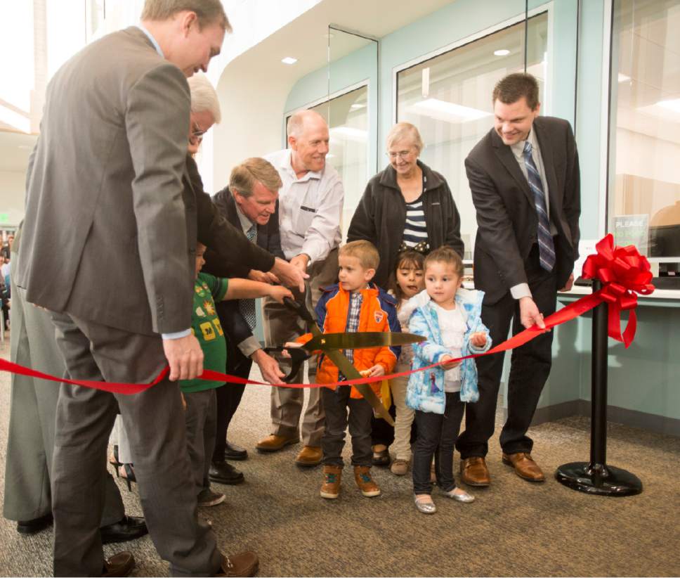 Rick Egan  |  The Salt Lake Tribune

Gary Edwards Executive Director of the Salt Lake County Health Department, gets a little help from children from the West Jordan Kindercare, during the ribbon-cutting of the new South Redwood Public Health Center in West Jordan,Thursday, November 3, 2016.