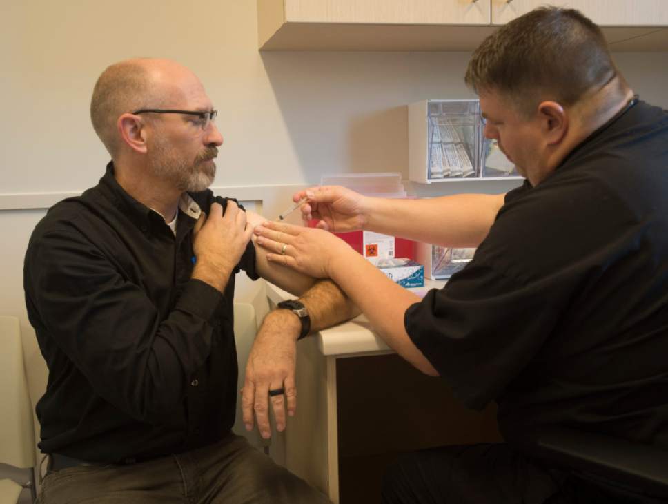 Rick Egan  |  The Salt Lake Tribune

Jeff Smart gets a flu shot from Jason Lowry, at the new South Redwood Public Health Center in West Jordan,Thursday, November 3, 2016.