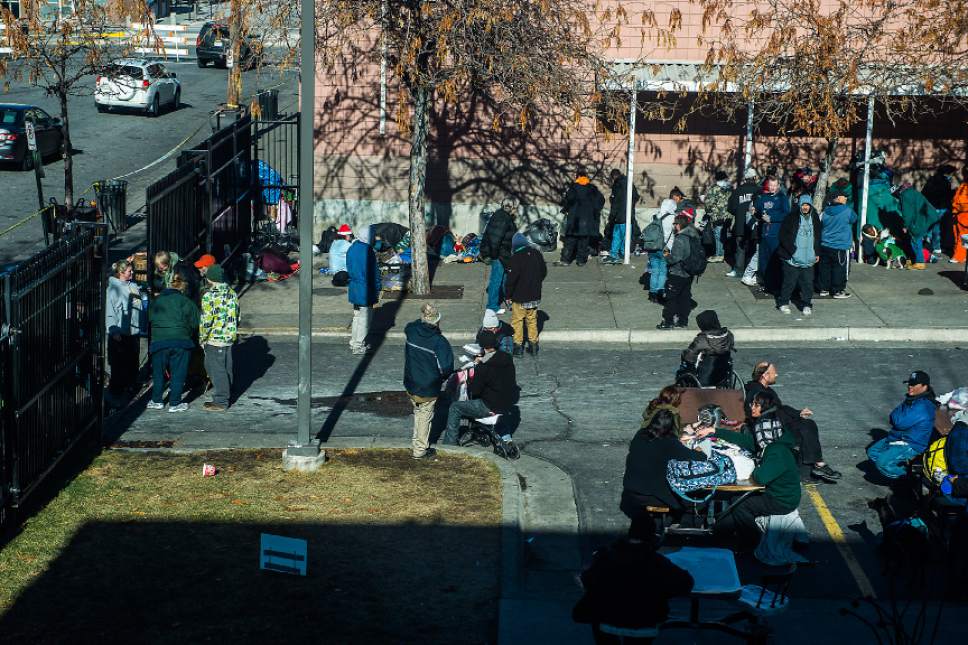 Chris Detrick  |  Tribune file photo
Homeless men and women congregate outside the Bishop Weigand Homeless Day Center Tuesday December 23, 2014.