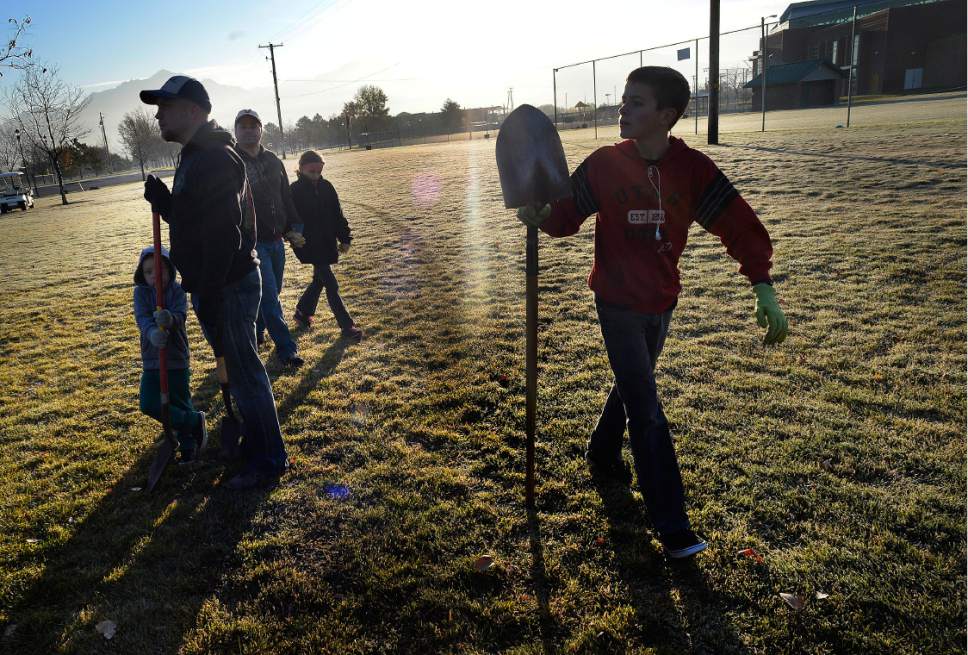 Scott Sommerdorf   |  The Salt Lake Tribune  
Volunteers split up to go to one of 76 spots where trees were to be planted to replace those damaged by vandals. 
Trees were replanted along 2200 West (between 7800 South and 9000 South), in Veterans Memorial Park in West Jordan, Saturday, November 5, 2016.