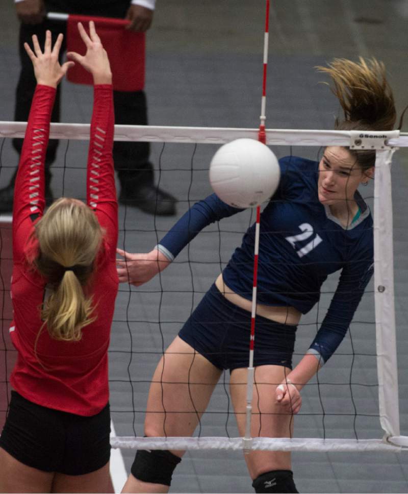 Rick Egan  |  The Salt Lake Tribune

Corner Canyon Chargers Zoe Tippers (21) hits the ball past the Bountiful defender, in 4A championship volleyball action, Bountiful vs. Corner Canyon, in Orem, November 5, 2016.
