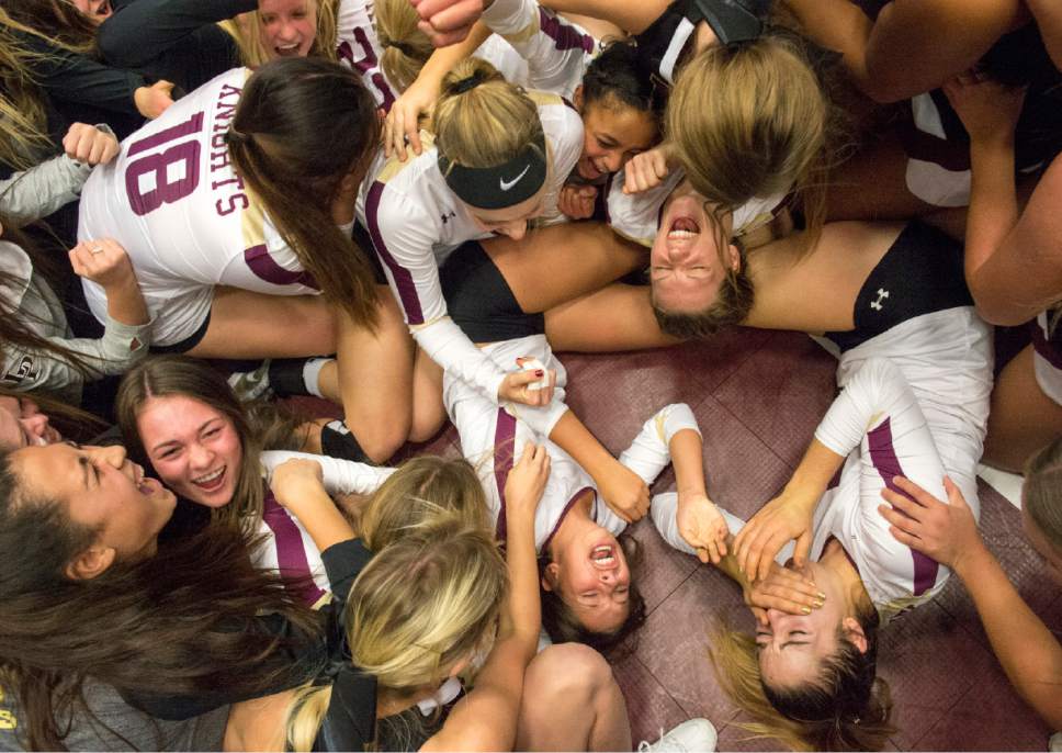 Rick Egan  |  The Salt Lake Tribune

The Lone Peak Knights celebrate their State title win over the Pleasant Grove Vikings in 5A championship volleyball game, in Orem, November 5, 2016.