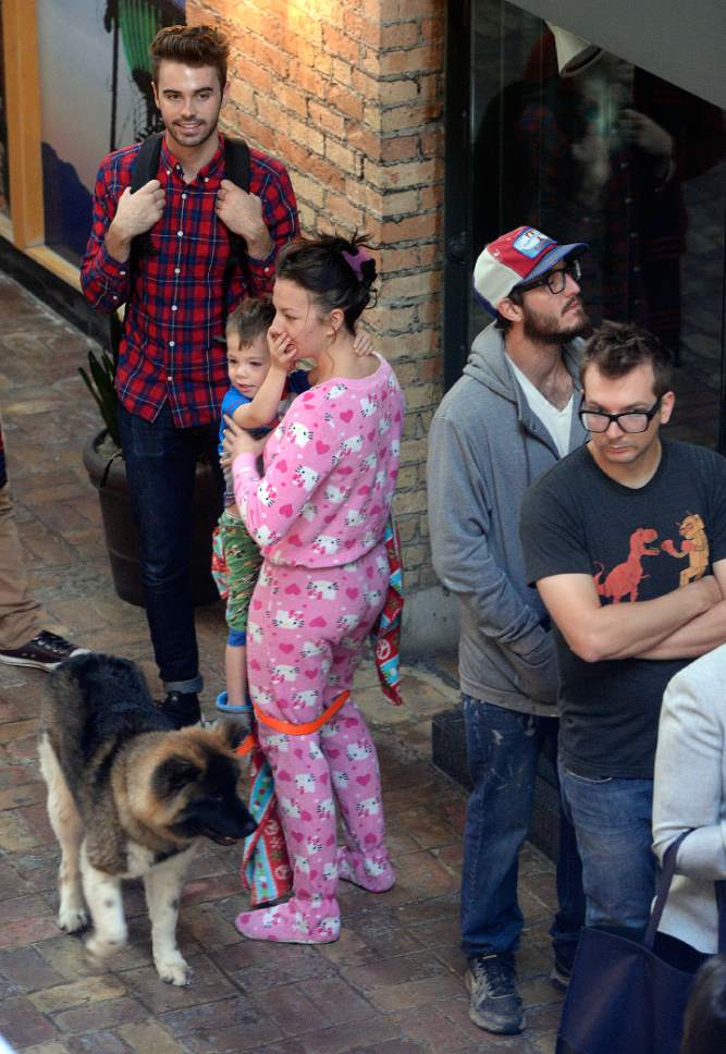 Al Hartmann  |  The Salt Lake Tribune
Ashley Carter, her young son Kayzenn and puppy Gypsy make a morning of it as they wait in line in their pajamas at the polling station at Trolley Square in Salt Lake City on election day Tuesday Nov. 8.  Poll workers are in for a long day.  People were waiting in line at 6 a.m. as they were setting up the station.  Lines were long at 8:30 a.m. with a wait of at least an hour to vote.
