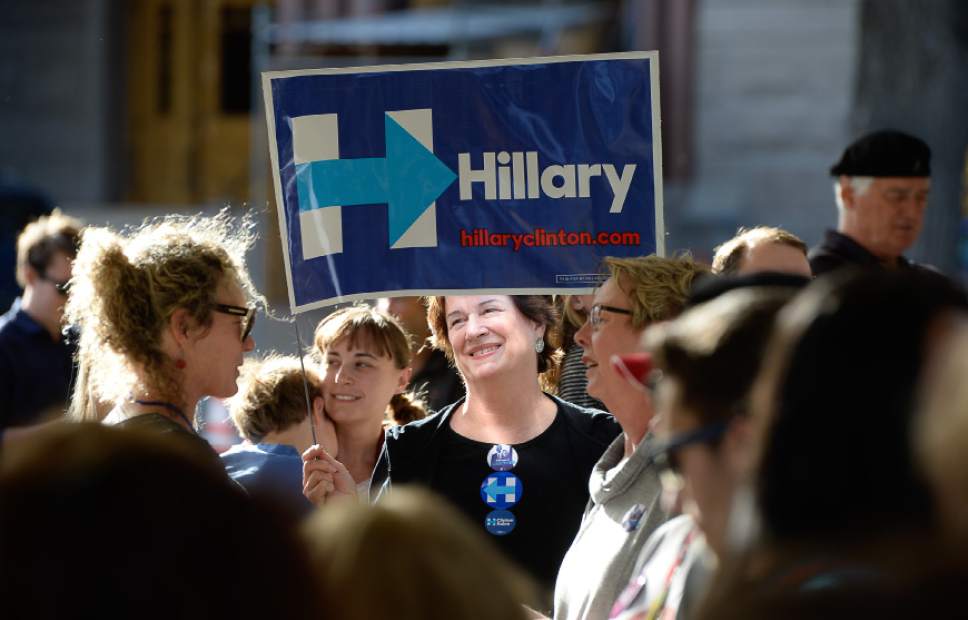 Francisco Kjolseth | The Salt Lake Tribune
Merry Harrison, center, joins others supporting Hillary Clinton for president as they wait for the arrival of Donna Brazile, chairwoman of the DNC, during a rally stop at the Salt Lake City and County building on Thursday, Oct. 27, 2016.