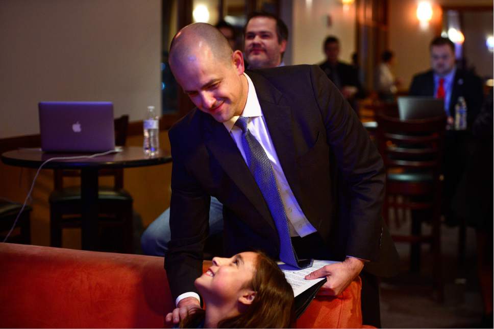 Scott Sommerdorf   |  The Salt Lake Tribune  
Presidential candidate Evan McMullin speaks with his daughter as they watch early returns at The Depot, Tuesday, November 8, 2016.