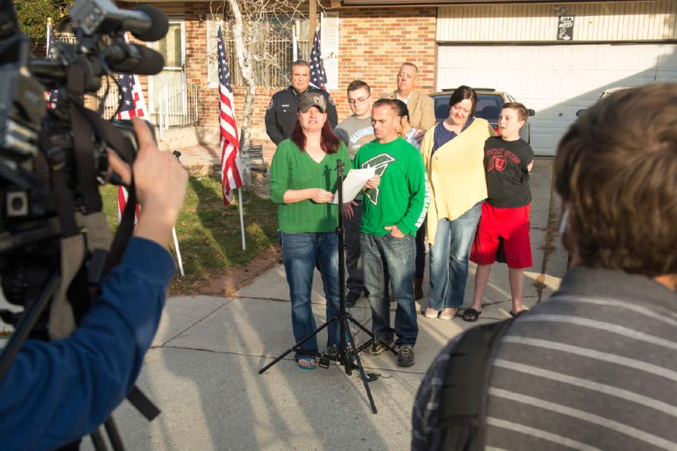 Rick Egan  |  The Salt Lake Tribune

Jenny Brotherson, the mother of West Valley Police officer Cody Brotherson, with her husband Jeff and other family members, makes a statement to the media, about her son Cody, in front of her home in West Valley City, Sunday, November 6, 2016.