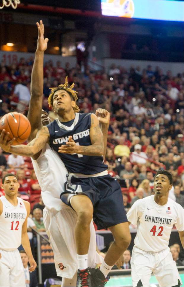 Rick Egan  |  The Salt Lake Tribune

Utah State guard Shane Rector (4) goes to the hoop for the Aggies, in Mountain West Tournament action, The Utah State Aggies vs. San Diego State Aztecs, at the Thomas and Mack Center in Las Vegas, Thursday, March 10, 2016.
