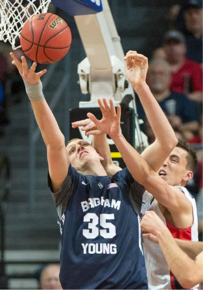 Rick Egan  |  The Salt Lake Tribune

Brigham Young Cougars forward Isaac Neilson (35) goes for a rebound along with Gonzaga Bulldogs guard Kyle Dranginis (3) in the West Coast Conference championship game, at the Orleans Arena, in Las Vegas, Tuesday, March 10, 2015