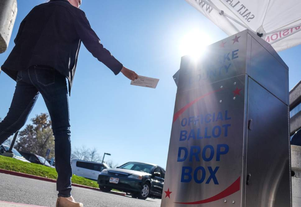 Francisco Kjolseth | The Salt Lake Tribune
A voter drops her ballot at an official ballot drop box that doesn't need a post date at the Salt Lake County complex on election day, Tuesday, Nov. 8, 2016.