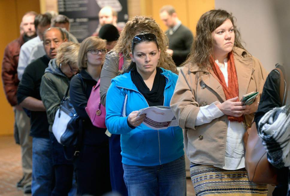 Al Hartmann  |  The Salt Lake Tribune
People line up at the Salt Lake County Building  on election day Tuesday Nov. 8 in Salt Lake City to vote before work.  Lines were long but moving steady.   The wait was less than 30 minutes to vote.