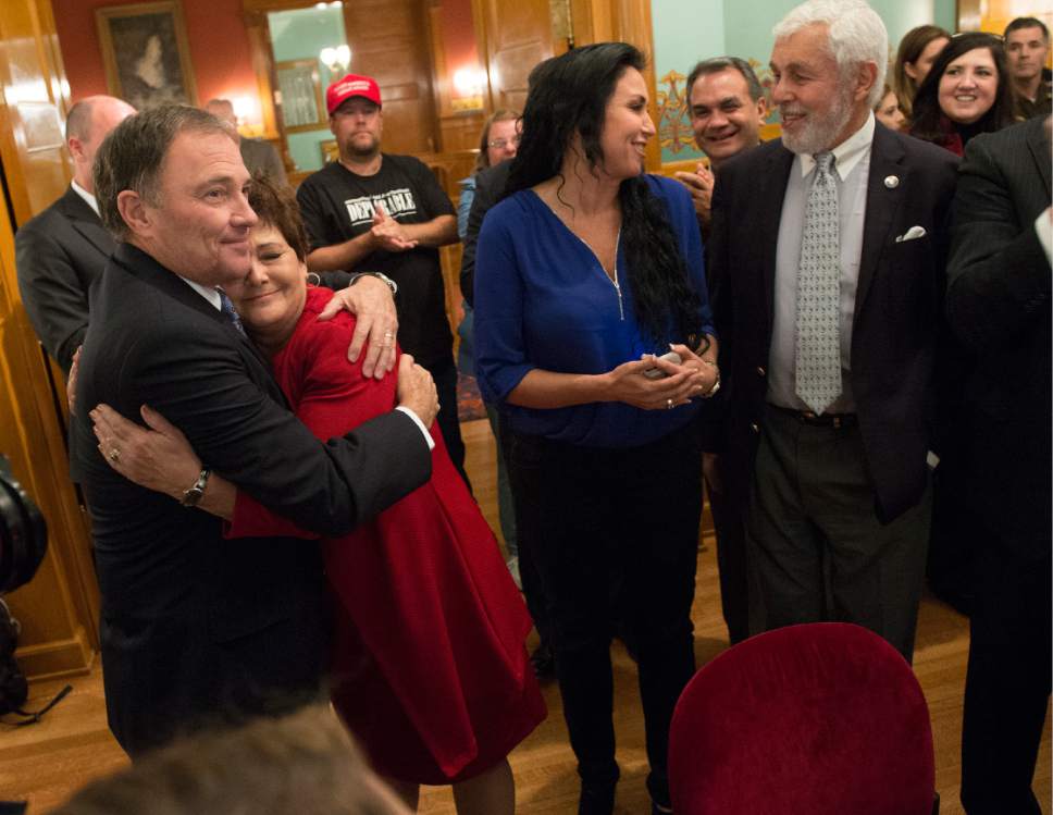 Leah Hogsten  |  The Salt Lake Tribune
Incumbent Republican Governor Gary Herbert celebrates his victory with a hug for his wife Jeanette in front of supporters, friends and family after defeating former CHG Healthcare Services CEO Democrat nominee Mike Weinholtz to seize a third term in office.