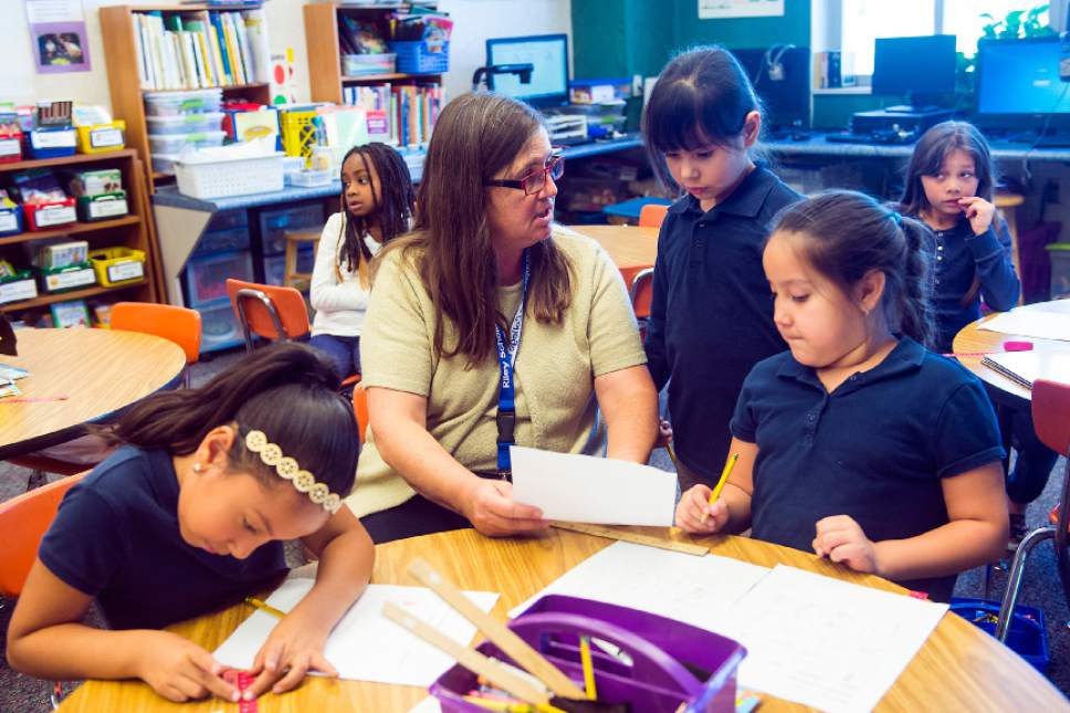 Chris Detrick  |  The Salt Lake Tribune
Christi Paulson's works with Chaila Garcia Avila, center, in her second grade class at Riley Elementary School Wednesday November 9, 2016.