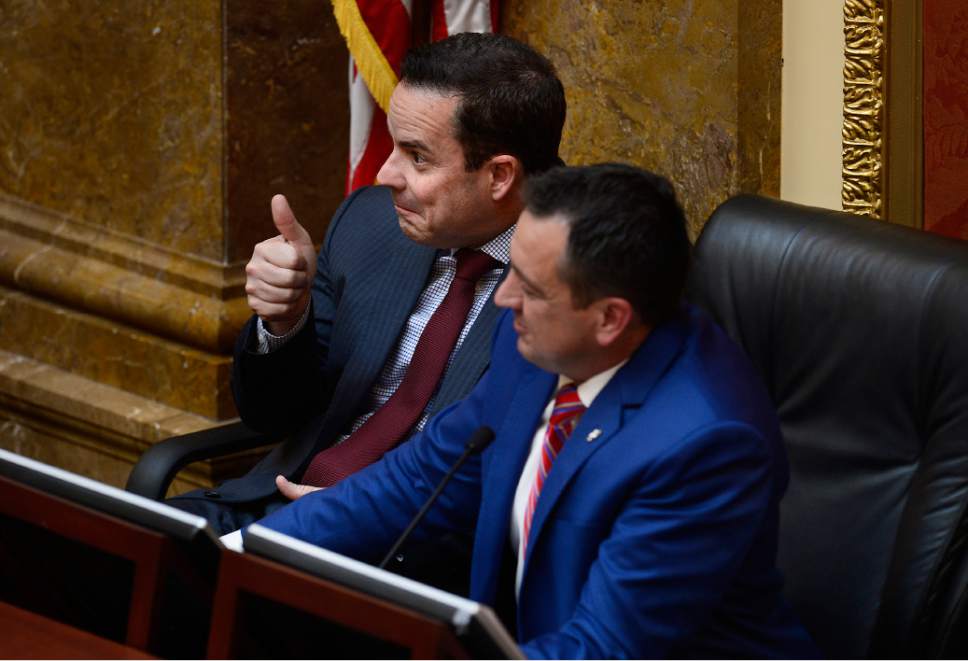Scott Sommerdorf   |  The Salt Lake Tribune
Rep. Brad Wilson, R-Kaysville, sitting next to Speaker of the House Greg Hughes, R-Draper, gives a joking thumbs up to Rep. Steven Barlow, R-Fruit Heights, after his introduction of his bill, 1HB148 - State Employee Health Clinic - in the Utah House of Representatives, Wednesday, February 25, 2015.