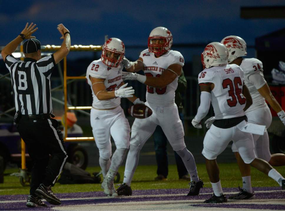 Leah Hogsten  |  The Salt Lake Tribune
Southern Utah Thunderbirds defensive back Kyle Hannemann (22) is mobbed by coaches and teammates for his interception in the second quarter to give SUU possession of the ball. Southern Utah University leads Weber State University 17-0, October 2, 2015 at Stewart Stadium in Ogden.