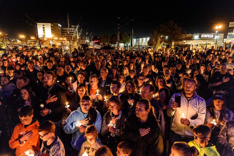 Trent Nelson  |  The Salt Lake Tribune
A large crowd at a candlelight vigil to honor West Valley City police officer Cody Brotherson, who was killed Sunday while apparently trying to lay down tire spikes to stop a fleeing stolen car. Wednesday November 9, 2016.