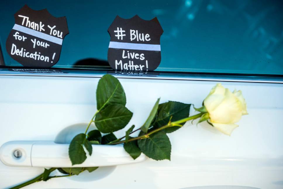 Chris Detrick  |  The Salt Lake Tribune
West Valley City police officer Cody Brotherson's patrol car at Fairbourne Plaza in West Valley City Wednesday November 9, 2016. A candlelight vigil to honor Brotherson is planned for Wednesday evening at 7 p.m. at Fairbourne Plaza, located just west of West Valley City' city hall, 3600 S. Constitution Blvd. (2700 West).