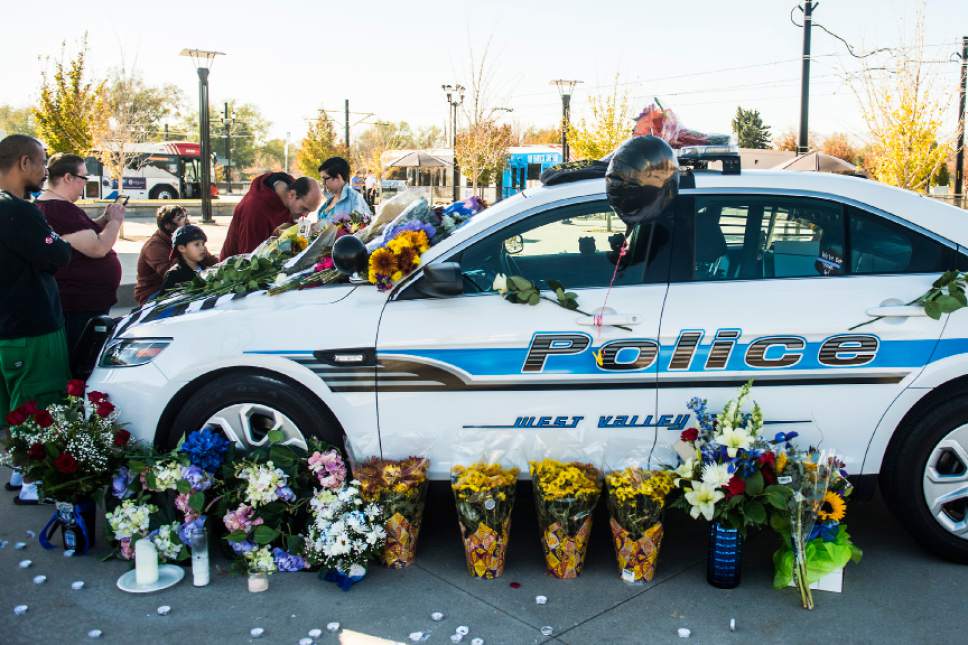 Chris Detrick  |  The Salt Lake Tribune
West Valley City police officer Cody Brotherson's patrol car at Fairbourne Plaza in West Valley City Wednesday November 9, 2016. A candlelight vigil to honor Brotherson is planned for Wednesday evening at 7 p.m. at Fairbourne Plaza, located just west of West Valley City' city hall, 3600 S. Constitution Blvd. (2700 West).