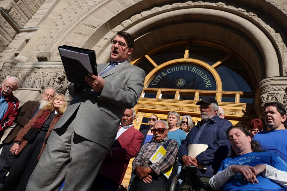 Francisco Kjolseth | The Salt Lake Tribune
The Rev. Curtis Price of First Baptist Church in Salt Lake City leads a prayer as he joins other church leaders, community groups and advocates to call on the mayor and City Council to "move forward as fast as possible" on the city's affordable housing crisis on Friday, Nov. 11, 2016.