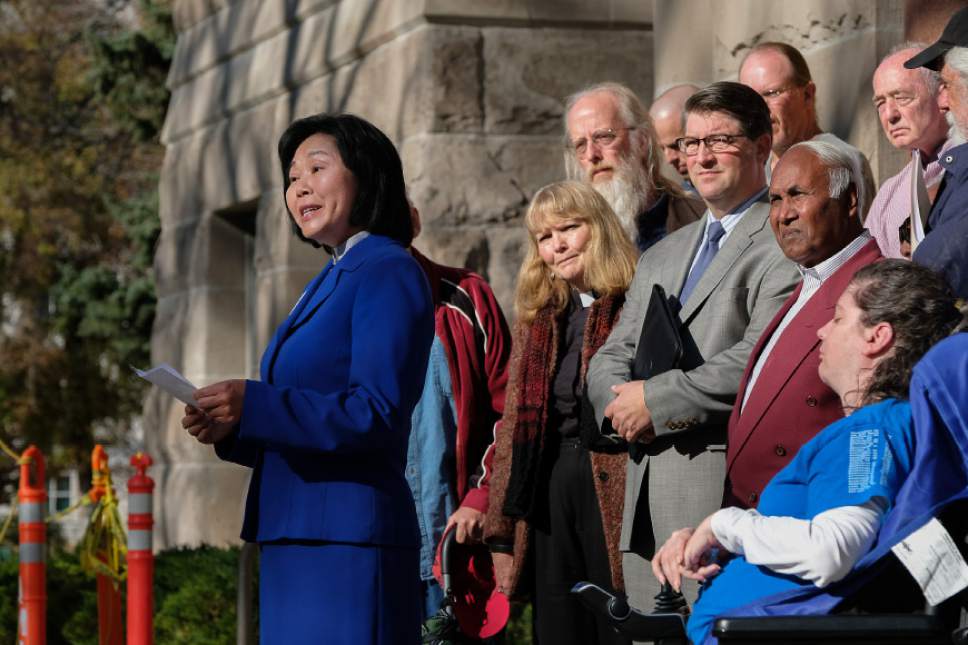 Francisco Kjolseth | The Salt Lake Tribune
The Rev. Elizabeth Tay McVicker of First United Methodist Church gathers with other church leaders, community groups and advocates to call on the mayor and City Council to "move forward as fast as possible" on the city's affordable housing crisis while gathered on the south steps of City Hall on Friday, Nov. 11, 2016.
