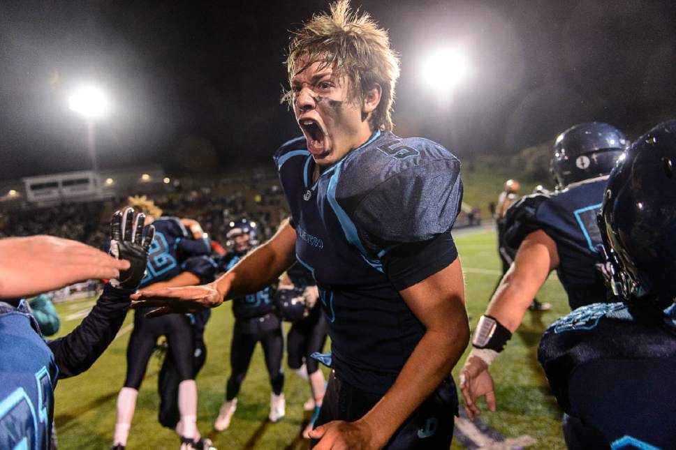 Trent Nelson  |  The Salt Lake Tribune
Juan Diego's Justin Sherrell (5) and teammates rush onto the field as Juan Diego defeats Morgan in the 3A high school football championship game at Weber State in Ogden, Saturday November 14, 2015.