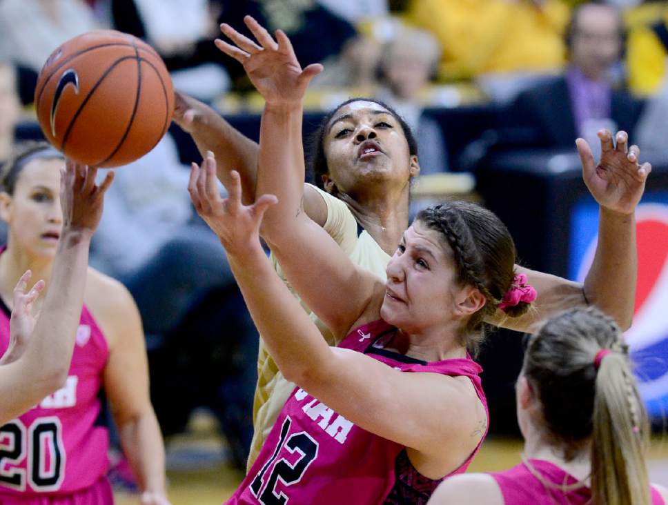 Utah's Emily Potter (12) battles with Colorado's Zoe Correal during the first half of an NCAA college basketball game in Boulder, Colo., Sunday, Feb. 7, 2016. Utah won, 76-68. (Cliff Grassmick/Daily Camera via AP) MANDATORY CREDIT